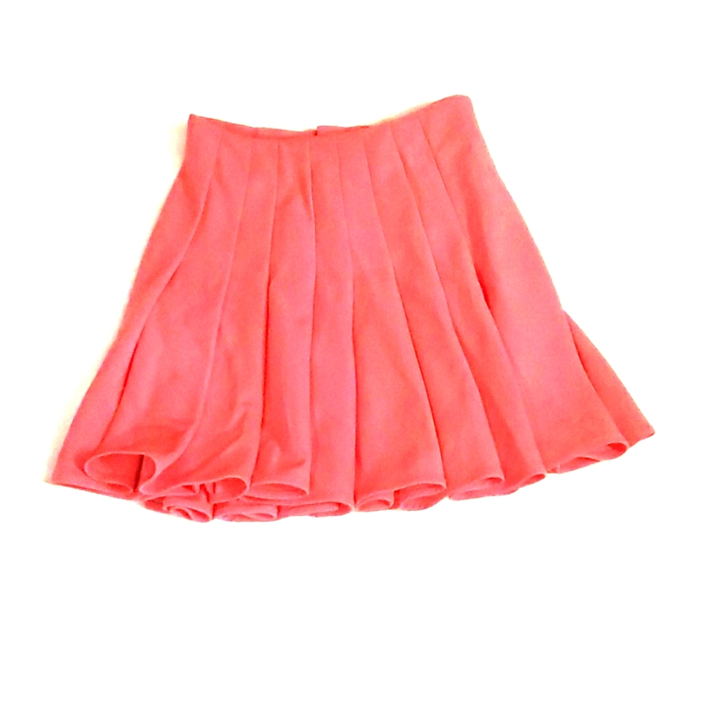 Pink Pleasted Mini Skirt sits mid Thigh